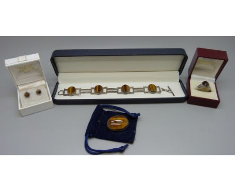 An Edinburgh silver and tigers eye jewellery suite; bracelet, brooch, ring and earrings, ring size R 