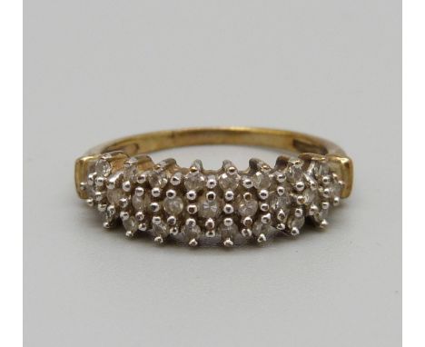 A yellow metal and diamond ring, marked 0.25 on the shank, 2.2g, M 