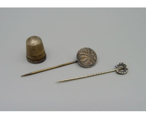 Two white metal stick pins and a silver gilt Hovis Bread advertising thimble hallmarked Birmingham 1911 