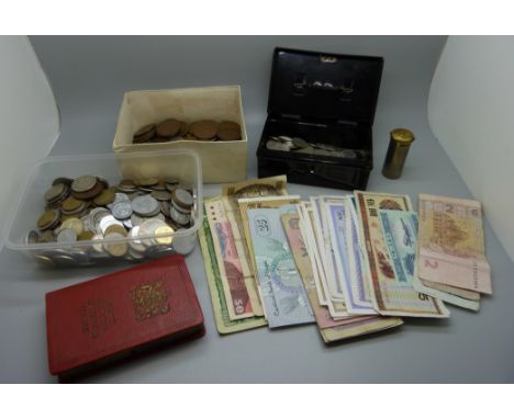 A Chad Valley money tin with over 100 sixpences, a box of old pennies, foreign coins and banknotes, a Magic Pocket Savings Ba