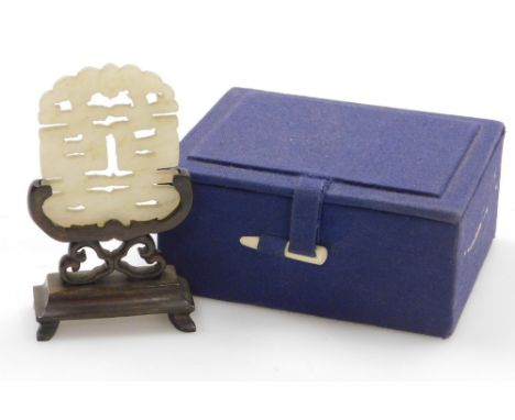 A Chinese carved and pierced jade 'long life' character, on stained wood base, 9cm high, boxed.