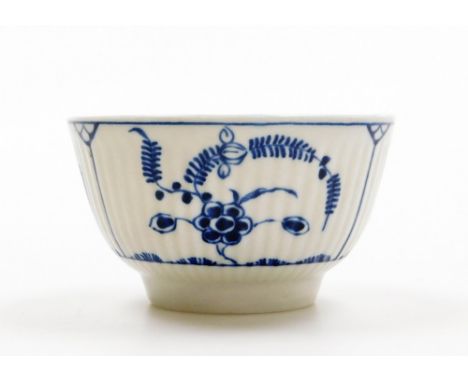 A Worcester tea bowl, on white finish with blue floral detailing, C stamp to underside, 8cm diameter.