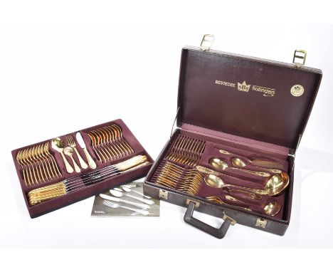 A Bestecke Solingen 24ct gold plated canteen of cutleryComprising twelve table knives, twelve table forks, twelve dessert spo