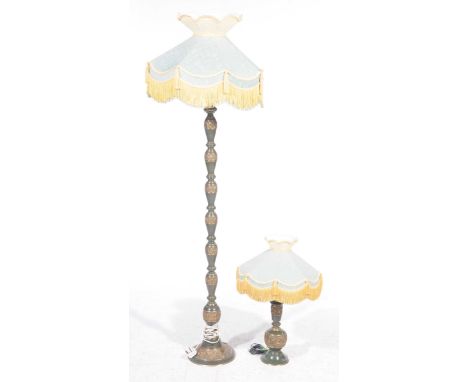 A Japanese influence painted metal lamp standardWith a pagoda shaped shade raised on a repeating baluster column with banded 