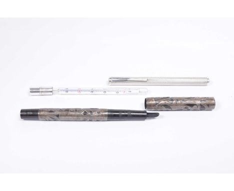 A silver thermometerTo an engine turned cylindrical case, bearing import marks for London, possibly 1965, length 11cm, togeth