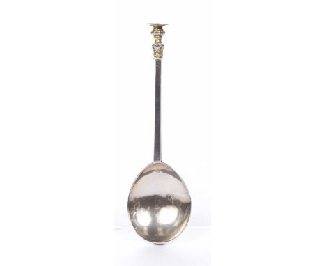 A mid 17th century English Provincial silver seal top spoon The tapered faceted stem with baluster knop, the disk bearing pri