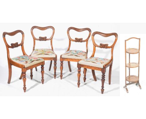 A set of four Victorian compressed balloon back dining chairsEach chair with a C scroll centre rail above drop in tapestry se