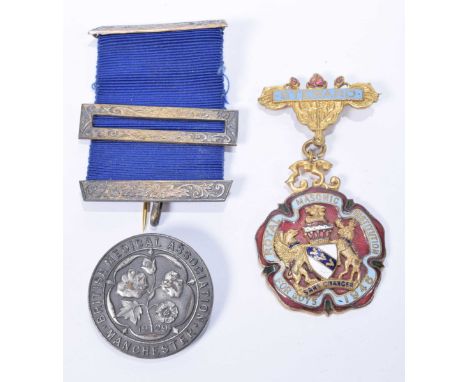 A gilt metal and enamel Stewards Masonic JewelSilver and blue ribbon medal mount and a white metal lapel badge.