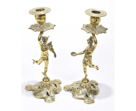 A pair of 19th/20th century brass candlesticks The pierced triform base rising to figural stem modelled as Hermes and Diana, 