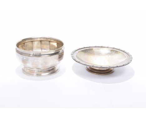 A silver dishOf circular form with an applied Celtic border, raised on a pedestal foot, by David Lawrence Silverware, Birming