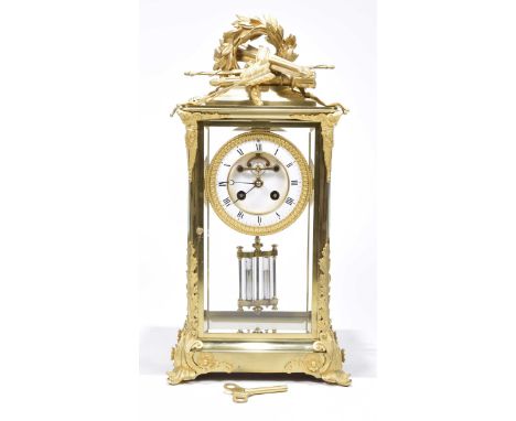 A French late 19th century gilt brass four glass mantle clockThe four glass case set within gilt brass raised on swept acanth