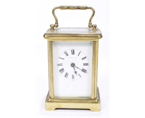 A French 19th Century four-glass brass carriage clockThe corniche case adorned with reeded loop handle enclosing the white en
