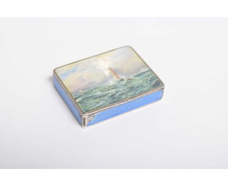 A silver and enamel compactThe lid with an enamel lighthouse and sea scape, with blue enamel to the sides AF, the interior wi