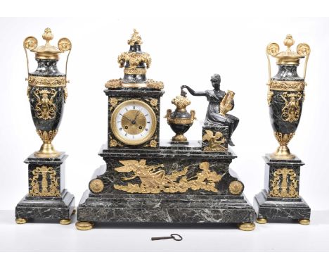 A late 19th century French marble and gilt metal eight day clock garnitureThe stepped base on compressed toupee feet rising t