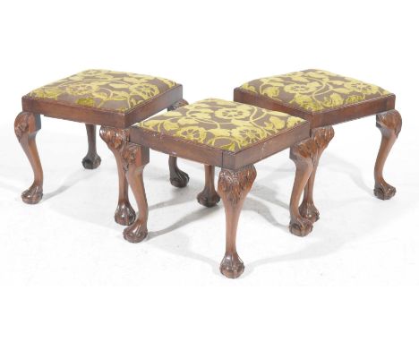 A trio of Chippendale type dressing stools, early 20th CenturyEach stool with a drop in padded seat covered in foliate fabric