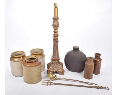 A mixed collection of itemsTo include three stoneware jars, two stoneware bottles, a brass ladle and toasting fork and a cont