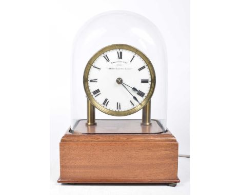 An early 20th Century Eureka Clock Company of London Limited thousand day electric clock The brass faced clock with white ena