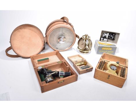 A collection of microscopes and barometersTo include a leather clad precision micro barometer, two microscopes, a boxed Penta