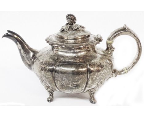 A Victorian silver pumpkin pattern teapot with cast finial and engraved decoration - London, 1849