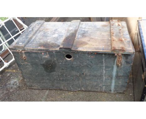 A large pine lift-top trunk of plank construction with black painted finish