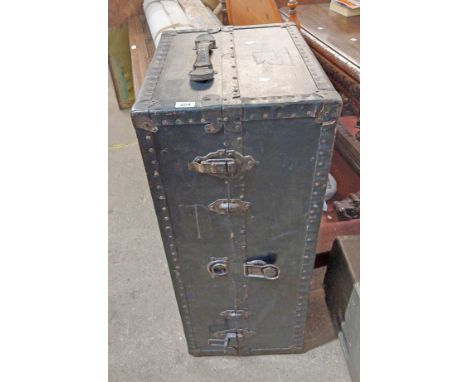 An early 20th Century travelling wardrobe trunk with flight of five graduated drawers and fold-out hanger rails