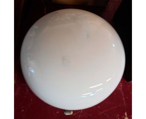 A vintage wall lamp with opaline cushion shade