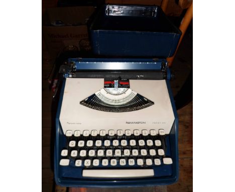 A vintage Remington Sperry Rand Envoy III portable typewriter in original hardshell carry case