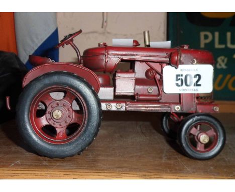 A modern tin plate model of a tractor