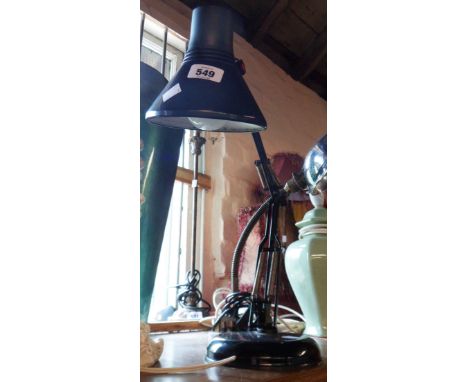 A modern black anglepoise desk lamp