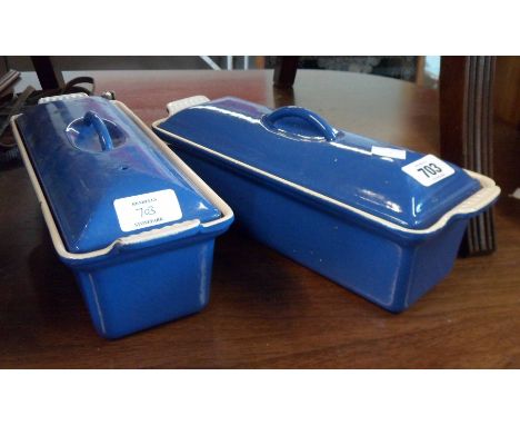 A pair of Le Creuset cast iron and enamel lidded serving dishes in the blue colourway