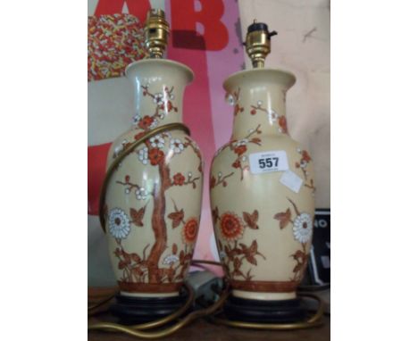 Two ceramic table lamps of vase form decorated with prunus blossom design