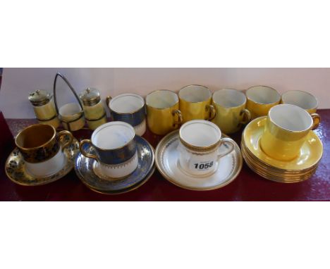 A small selection of ceramic items including a Maling pottery coffee can and saucer with gilt and cobalt blue floral decorati