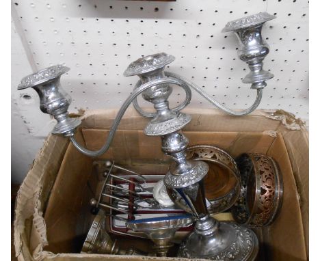 A box containing a quantity of silver plated items including a two branch three light candelabrum, pair of wine coasters, etc