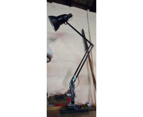 A vintage Herbert Terry anglepoise lamp with stepped base, original black finish and original Bakelite fitting