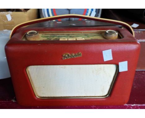 A vintage Roberts R500 portable transistor radio with red leatherette case