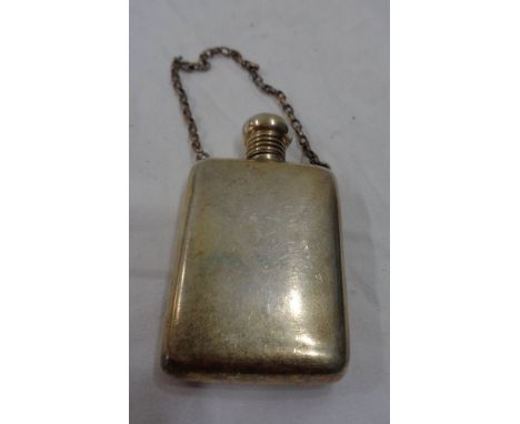 A Birmingham silver flask style scent bottle with screw cap and suspender chain