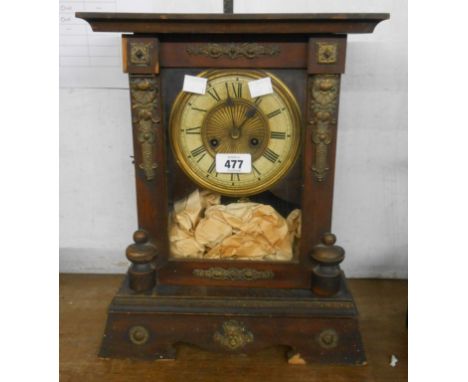 A late 19th Century German stained walnut cased shelf clock with visible pendulum and gong striking movement