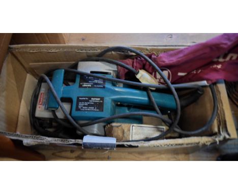 A Makita belt sander - sold with a Zyliss clamp vice