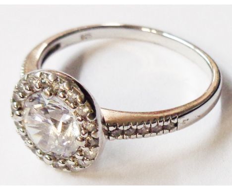 A marked 925 white metal diamond style ring