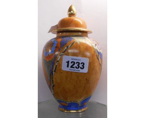 A Carltonware Art Deco pottery vase and cover decorated with stylised flowerheads and trees on an orange ground - a/f to lid