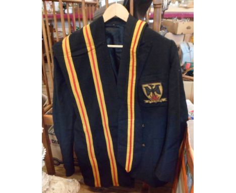 A vintage school blazer with pocket patch and scarves