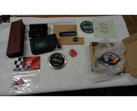 A bag containing a quantity of mainly Mini motoring related items including Devon Vintage Car Club enamel badges, etc.