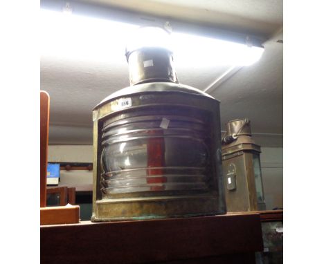 An old brass ship's masthead lamp - adapted for porch light use
