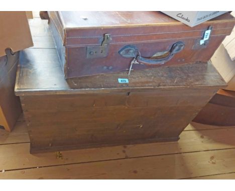 An 82cm antique stained pine lift-top trunk, set on plinth base - replacement hinges