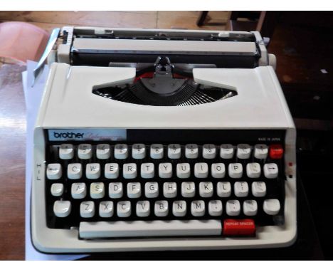 A vintage Brother Delux 850TR portable typewriter in original hardshell case