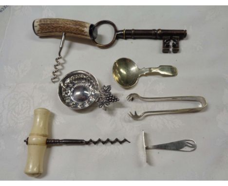 A bag containing a quantity of assorted collectable items comprising ivory handled corkscrew, novelty key form corkscrew, whi