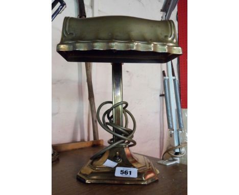 A vintage brass banker's style desk lamp of column form with adjustable shade