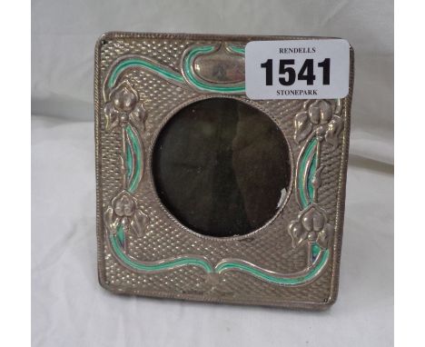 An Art Nouveau design small silver and enamel fronted photograph frame with 5.5cm diameter aperture and wooden easel back