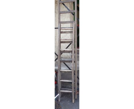 An old wooden extending ladder - for decorative use only