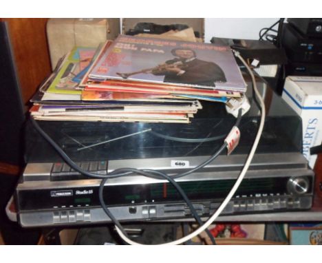 A vintage Ferguson Studio 15 record player, cassette deck, radio combination - sold with a quantity of LP records